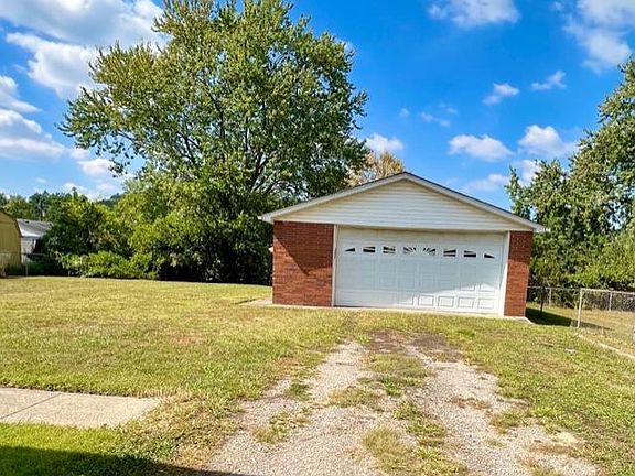 2 car garage with automatic door and workshop.