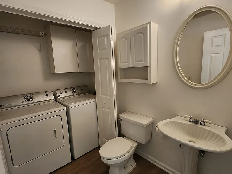 Powder room with laundry area. Conveniently located off of the dining room