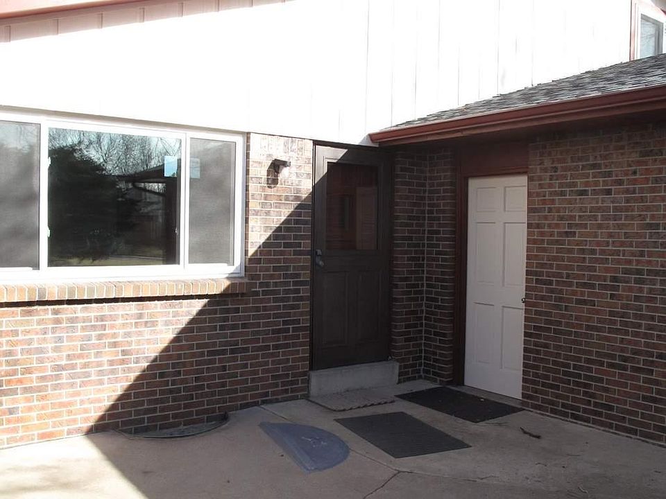 Front patio area showing door into garage