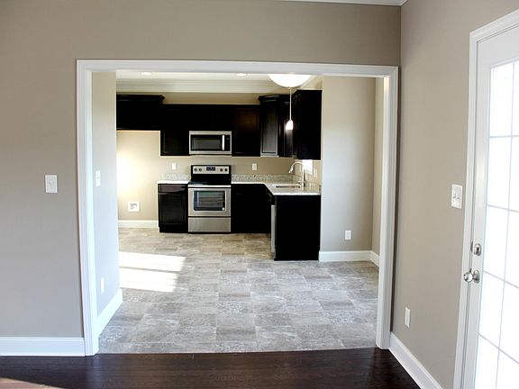Living room to kitchen and back patio