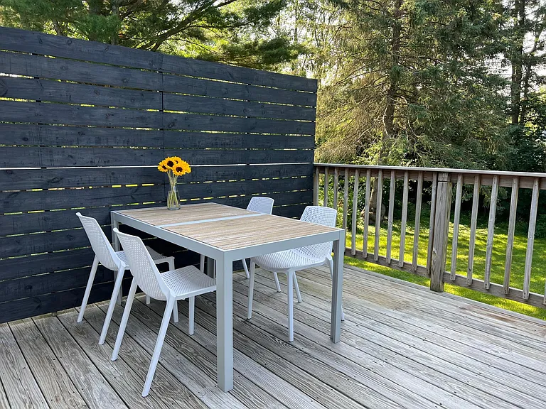 Sunny deck with private backyard
