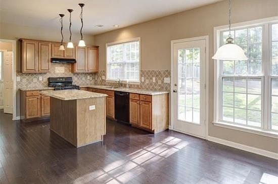 Kitchen, eating area - new stainless steel refrigerator and