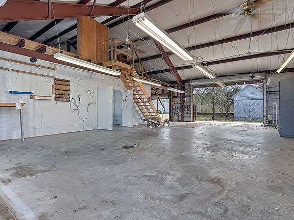 Insulated ceiling and a "Mezzanine" over half of the space of this amazing garage!!. 