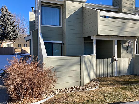 Condo is lower left with a small outside deck/sitting area accessible through sliding glass door.