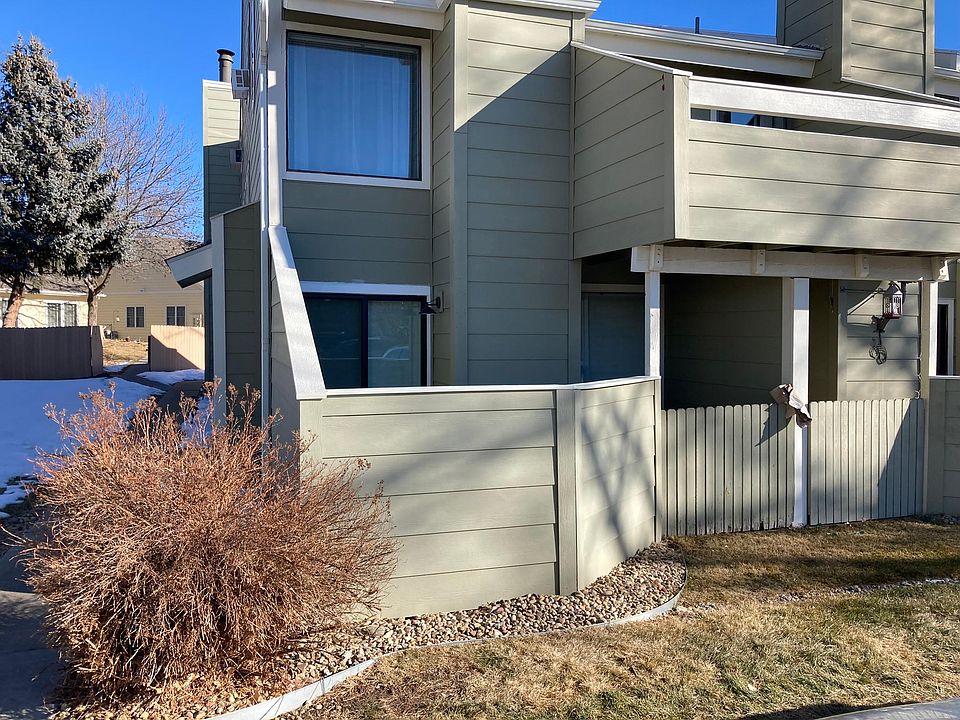 Condo is lower left with a small outside deck/sitting area accessible through sliding glass door.