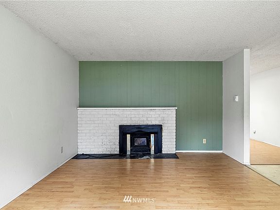  Living room with wood burning fireplace.