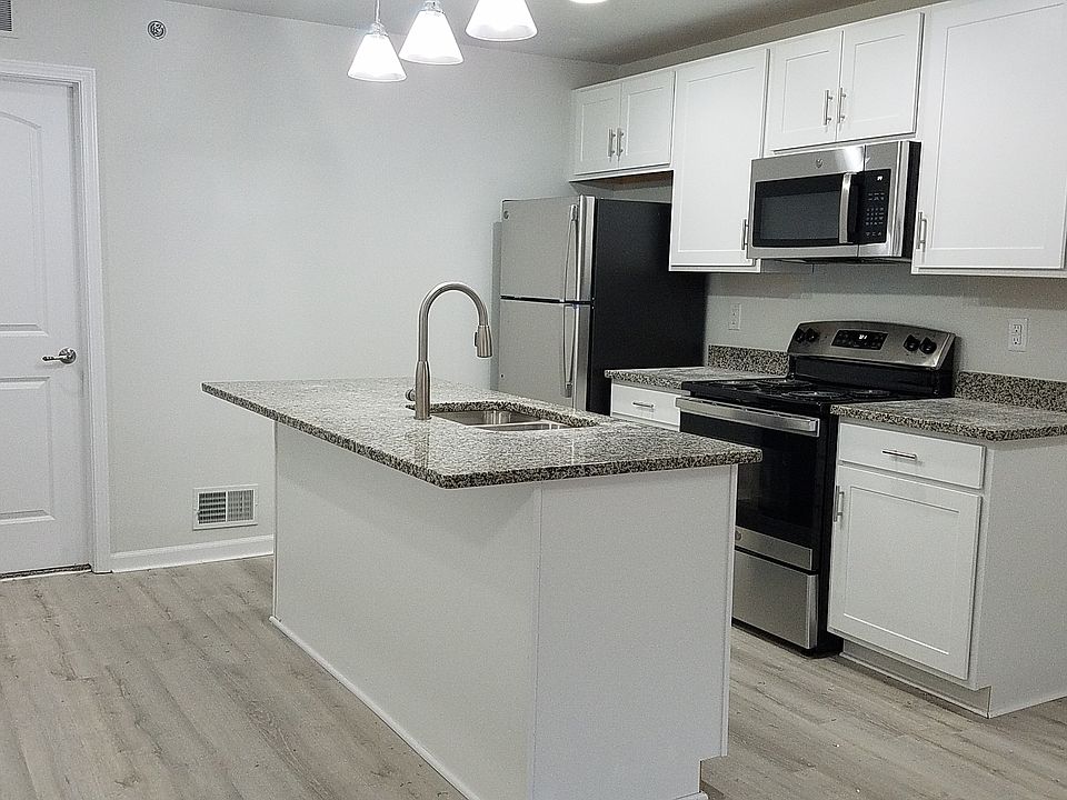 Kitchen with stainless appliances and granite countertop