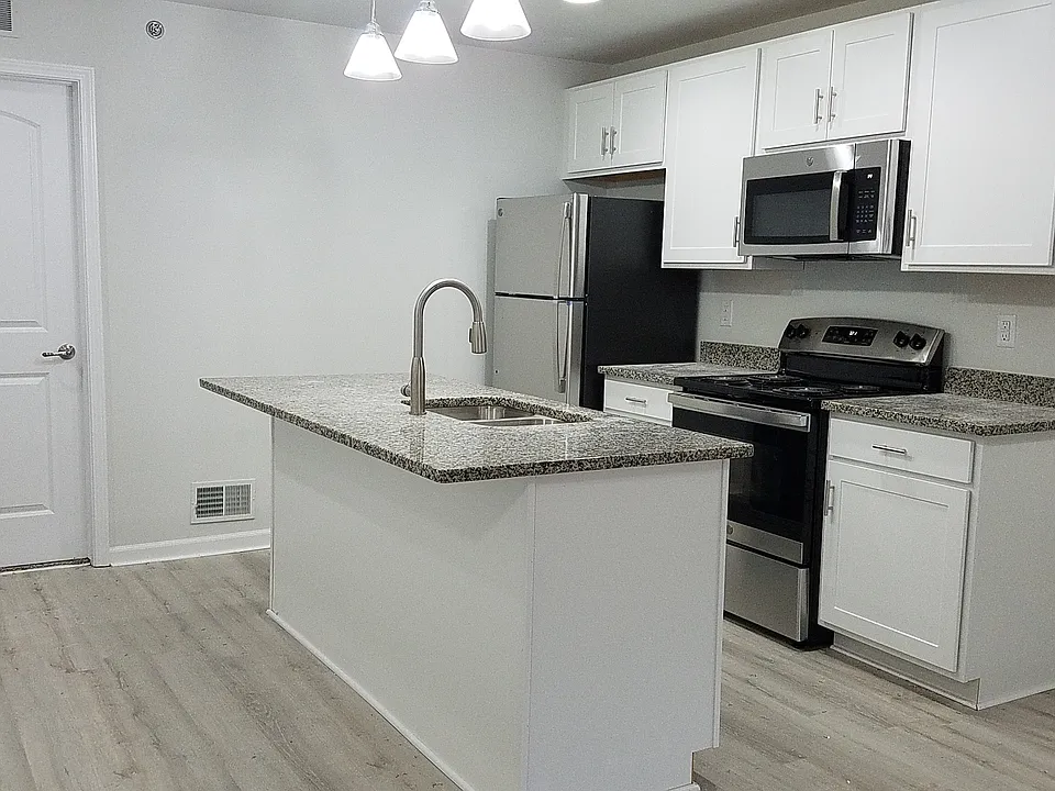Kitchen with stainless appliances and granite countertop