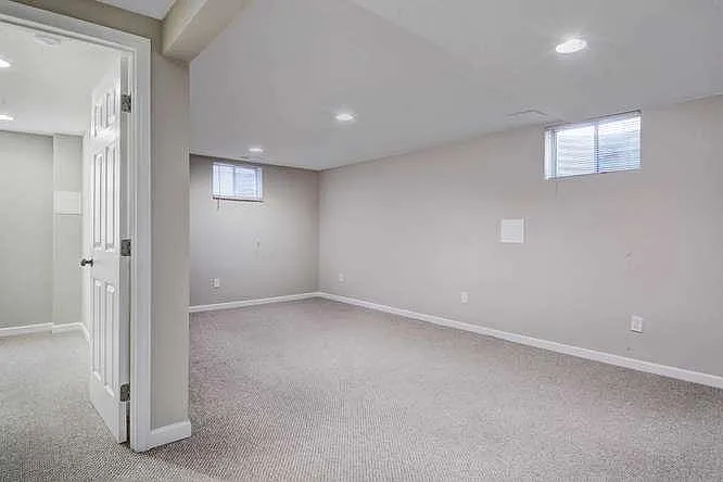 Lower level family room with bedroom on left