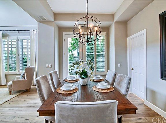 Formal dining room with modern light fixture