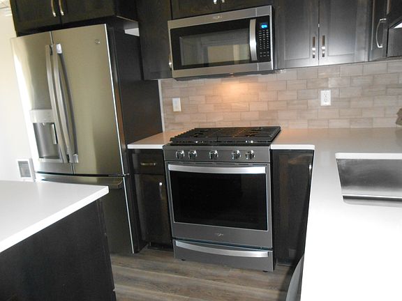 Desirable gas range and a microwave too.