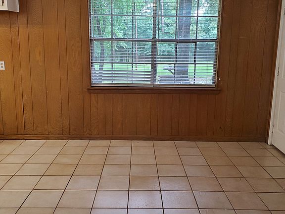 Great view of backyard from kitchen and dining room with tile floors