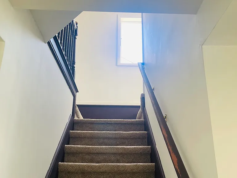 View up the stairs from the living room