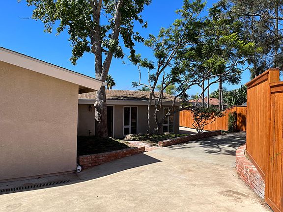 Spacious driveway and bonus driveway, could fit a small boat, trailer, or be used as extended patio area or/garden boxes.