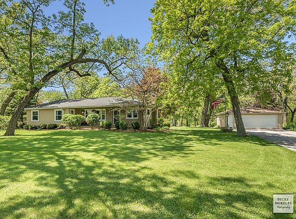 Another view of the front with the exterior detached garage