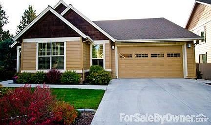 3 Car Garage
						:
						Garage contains built-in cabinets, workbench, and overhead storage.