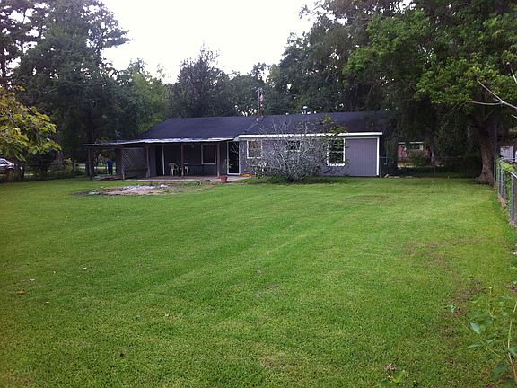 Covered back porch and large yard