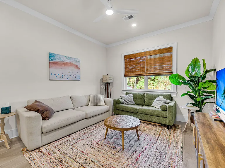 Variable speed fans in living and bedrooms pair with can lights throughout.