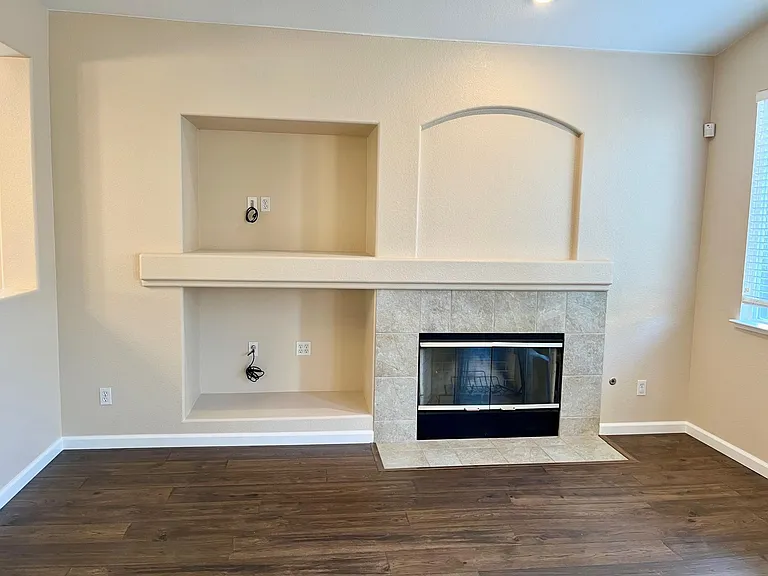 Family Room with Fireplace and provided cables and access port for Entertainment System