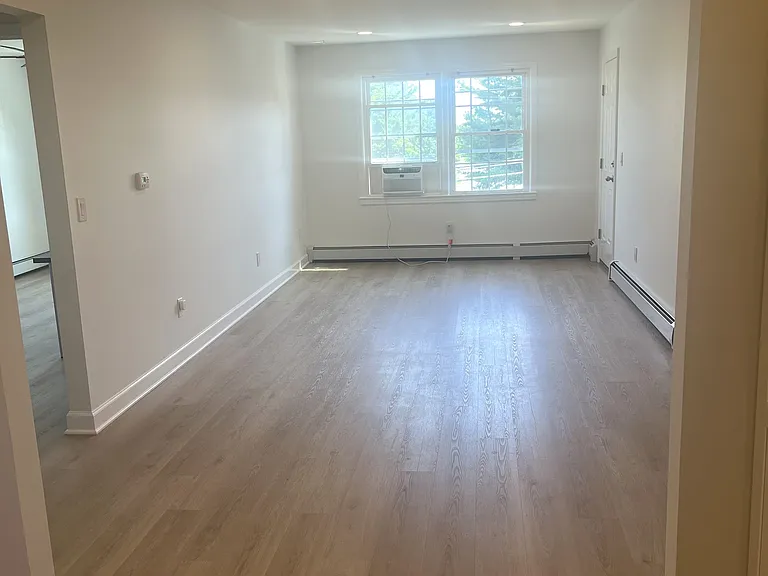 living room with new lvp flooring, recessed lighting