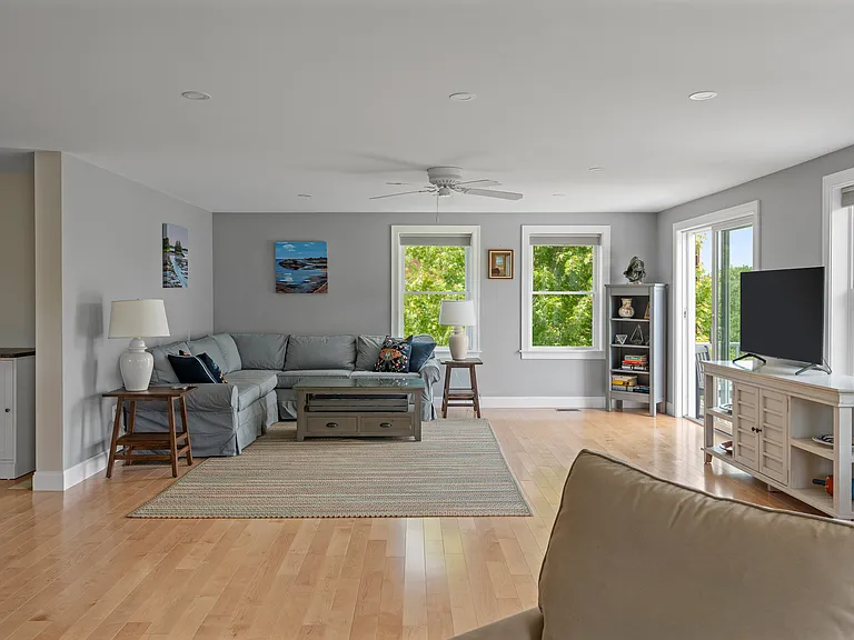 the living room adjacent to the grilling and dining deck