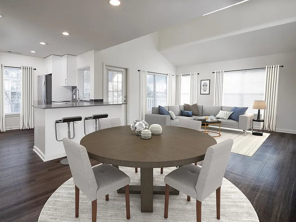 Kitchen, living, and dining areas with hard-surface flooring