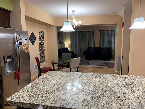 Open floor plan consisting of living and dining areas and kitchen
