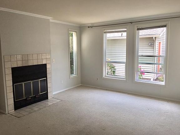 Sunny Living Room with Fireplace