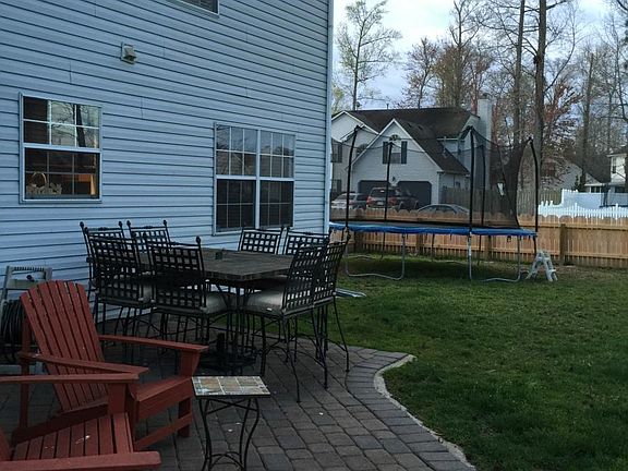paver patio off of screened in sun room 