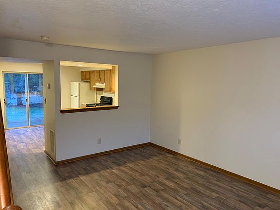 Living room with pass through to the kitchen.