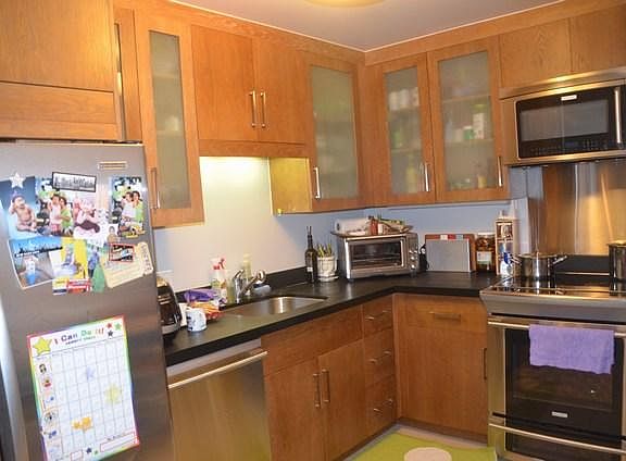 Kitchen with stainless appliances..microwave, stove, refrigerator, dishwasher.