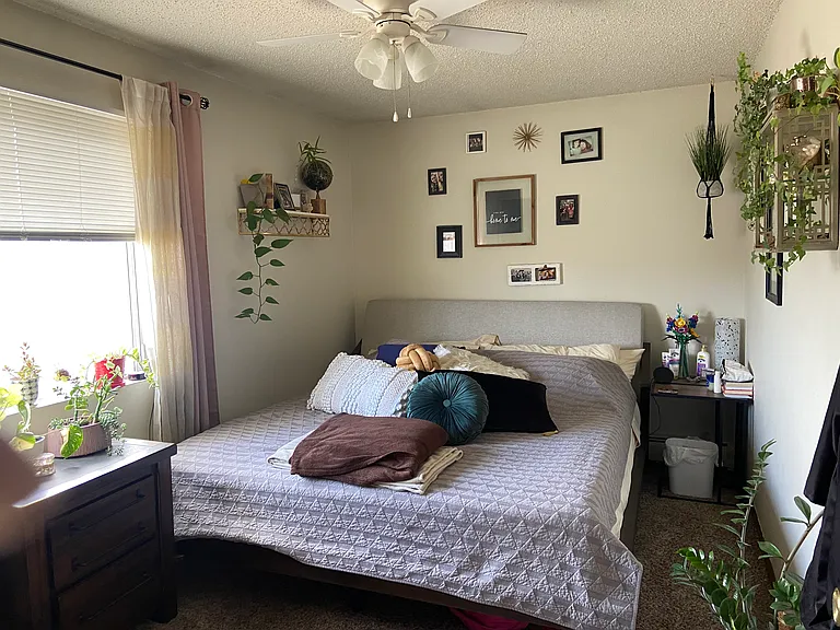 King size bed and dresser with nite table, wall a/c unit in this room