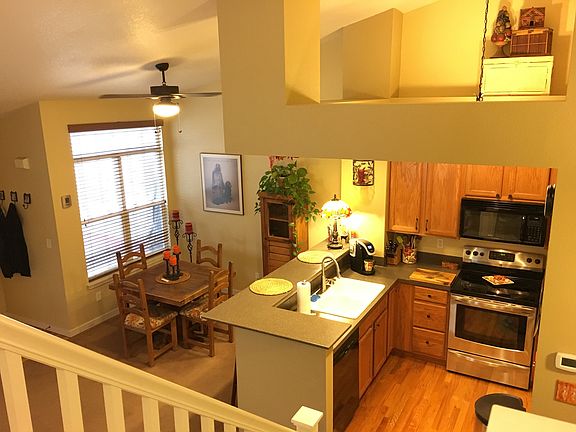 View of Kitchen & Dining Room from second floor hallway