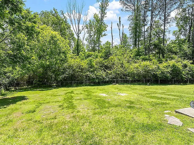 Spacious shared backyard, offering plenty of room for outdoor activities and relaxation.