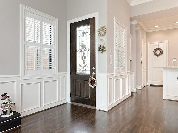 Entry leads to first floor living, dining and kitchen.