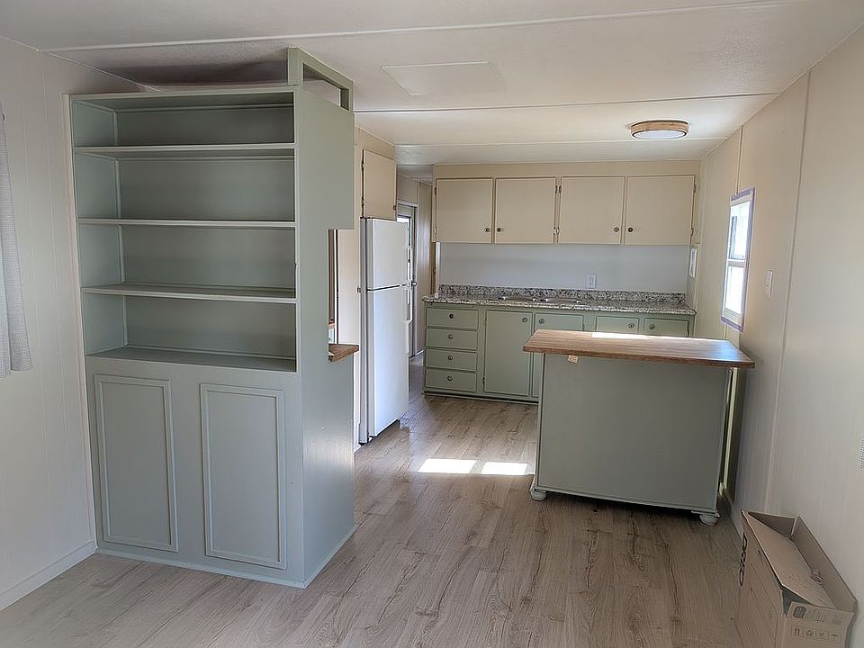 Beautifully painted wood, ki Kitchen island with seating for 