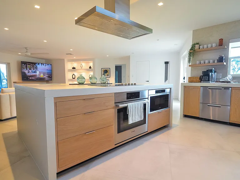 High-end stainless steel appliances throughout. Induction cooktop/oven