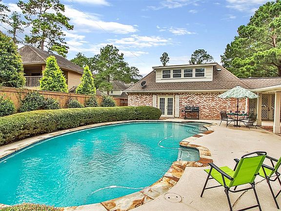 BACKYARD OASIS: The backyard is as pretty as the front, with a recently resurfaced pool as the focal point. On the first floor of the garage building and above the garage you'll find additional living space.