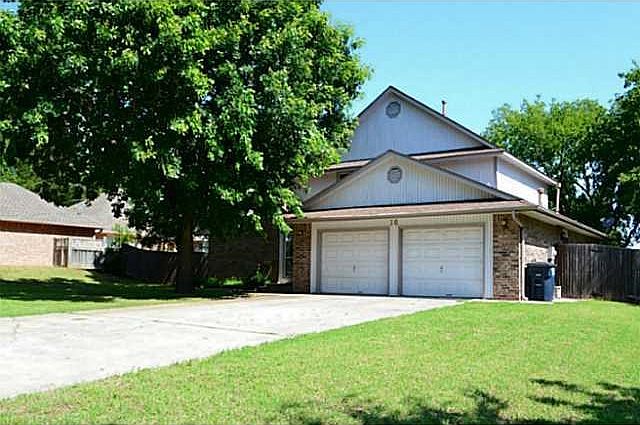 Exterior Front. Big shade tree, 2 car garage and long driveway!