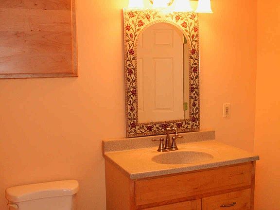 Powder room  Recently remodeled with newer fixtures. 