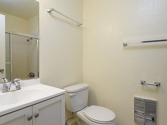 Bathroom with shower over tub