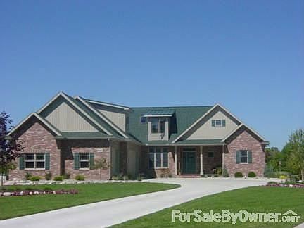 Front of Home From Cul-de-sac
						:
						3+Car Attached Finished Garage w/Side Bays (1,040 Sq.Ft.) w/12 Ft Work Bench
