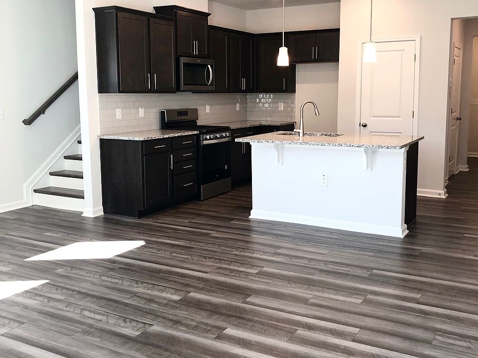 Beautiful dark walnut cabinets and upgraded stainless steel appliances