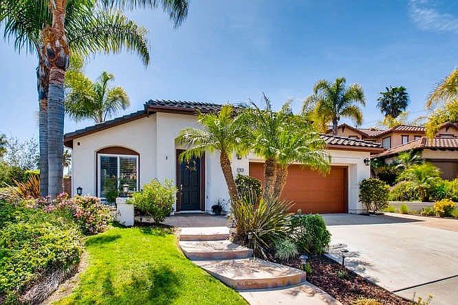 Welcome to 7915 Paseo Tulipero in desirable La Costa Valley! This special home has been remodeled to