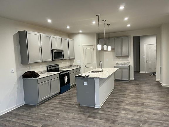 Spacious Kitchen with granite islands. All new appliances. Can accommodate. 3-4 chairs with the island.