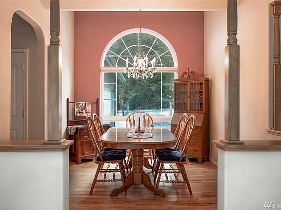 The formal dining room with high ceiling and arched window is immediately off the entryway and adjacent to the living room.  The space could also be used as an office.  