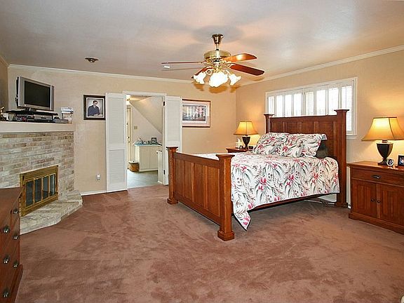 Master bedroom with fireplace, study and balcony
