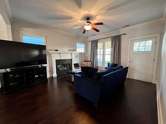 Front Entry to Spacious Living with fireplace, hardwoods, & lots of light