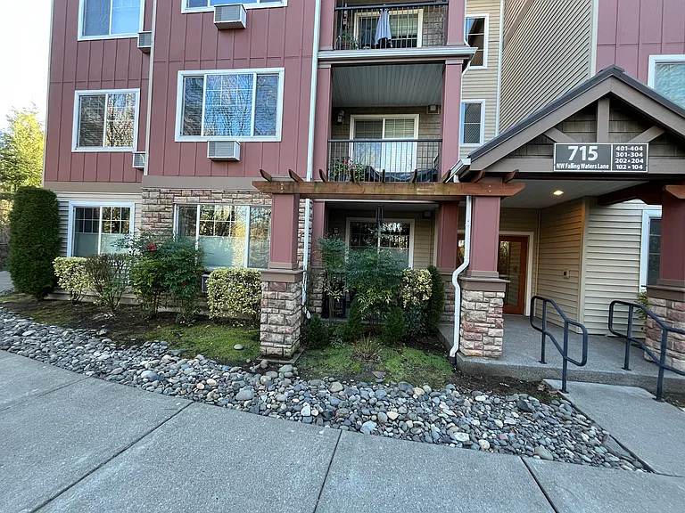 Rear entrance - Unit windows on lower left, including back patio