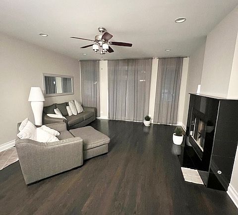 Upstairs living room with woodburning fireplace (option to keep furnished)